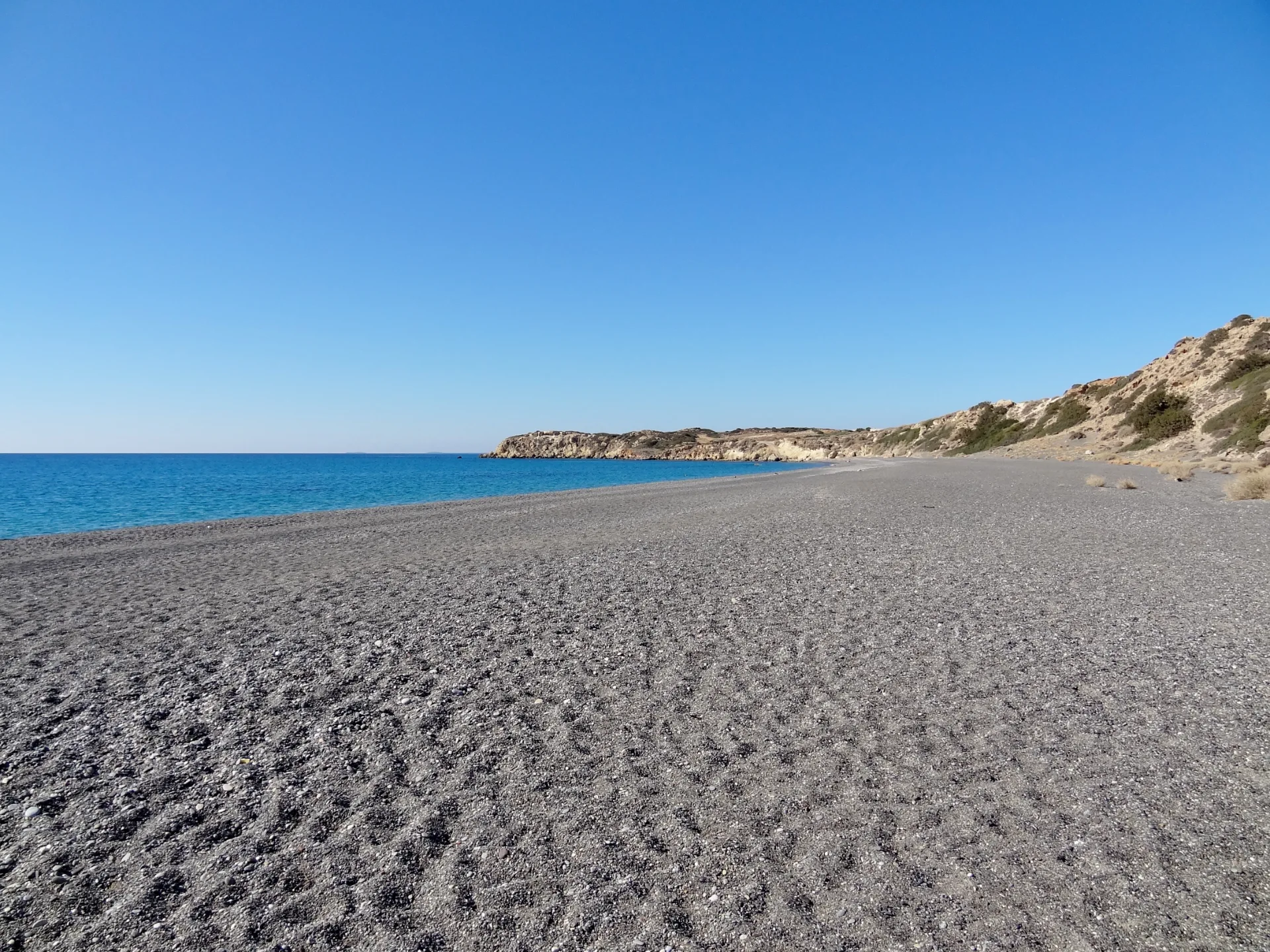 View across the long beach of Koutsounari near Ierapetra with its pebble shore and sea
