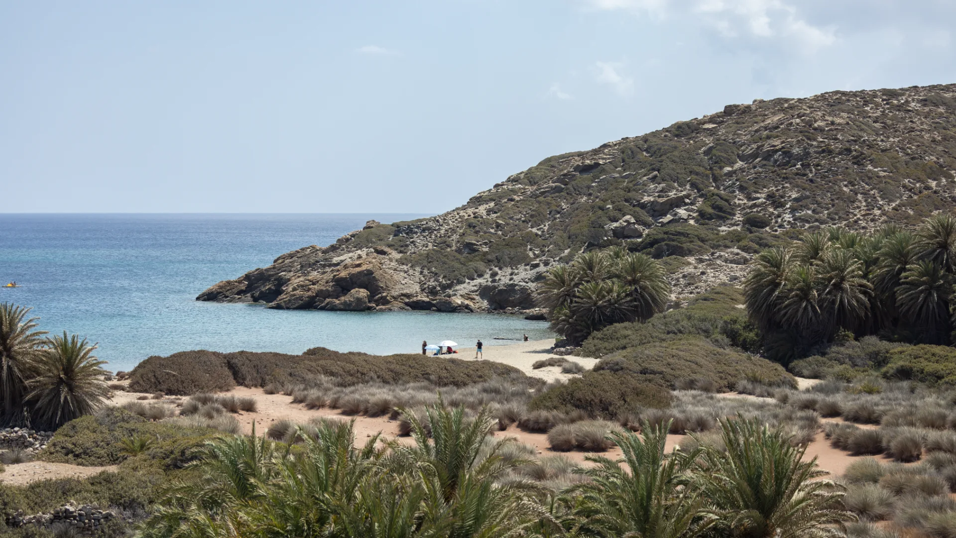 Coastal landscape at Itanos with a small bay, palms and the dry scenery of eastern Crete