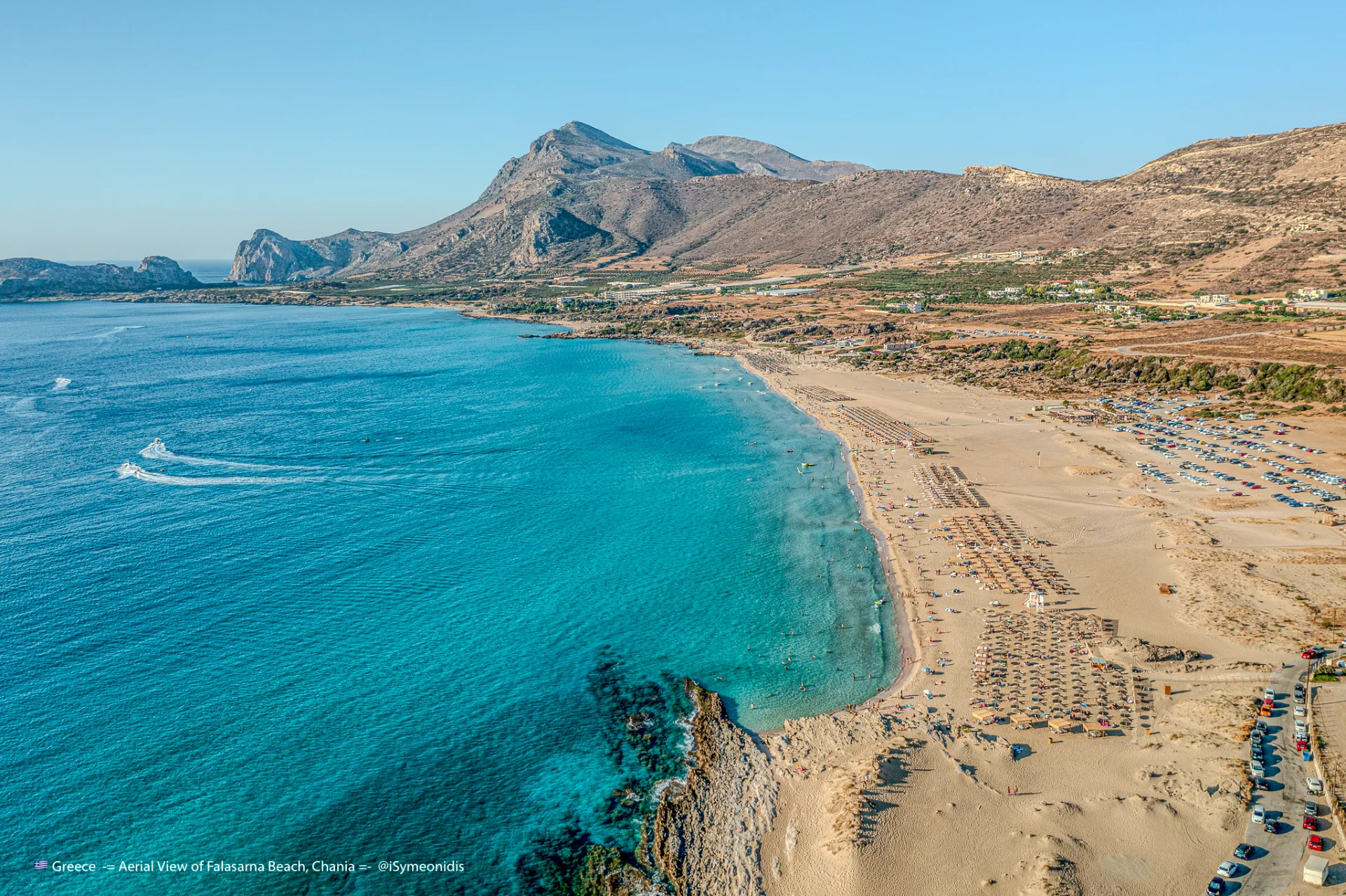 Aerial view of Falassarna with its long sandy beach, turquoise sea and western Crete mountains