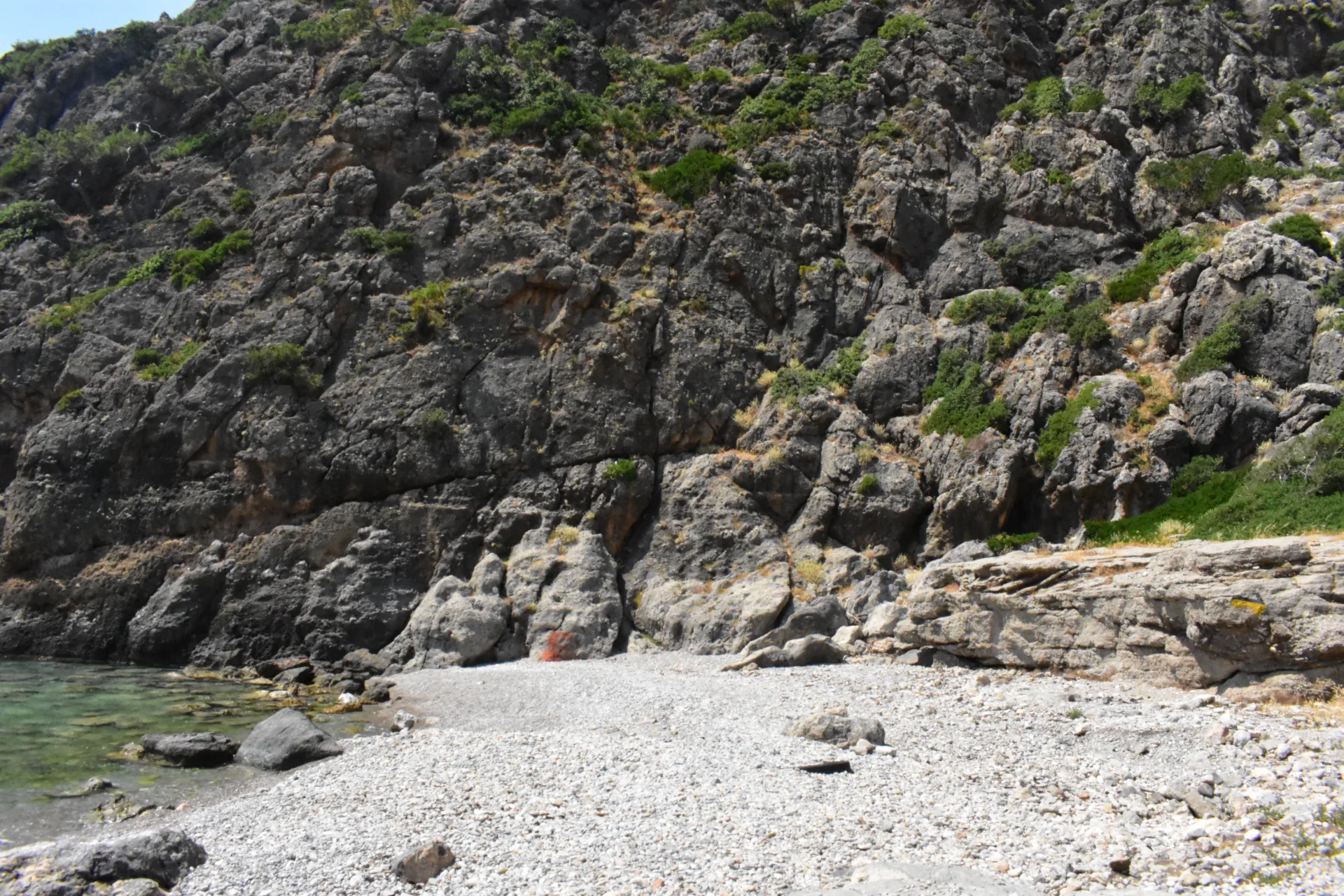 Coastal landscape at Sougia with pebble beach, sea and the mountains of southwest Crete